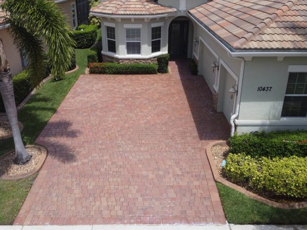 Brick driveway after professional paver sealing by Clean Master Exterior Services